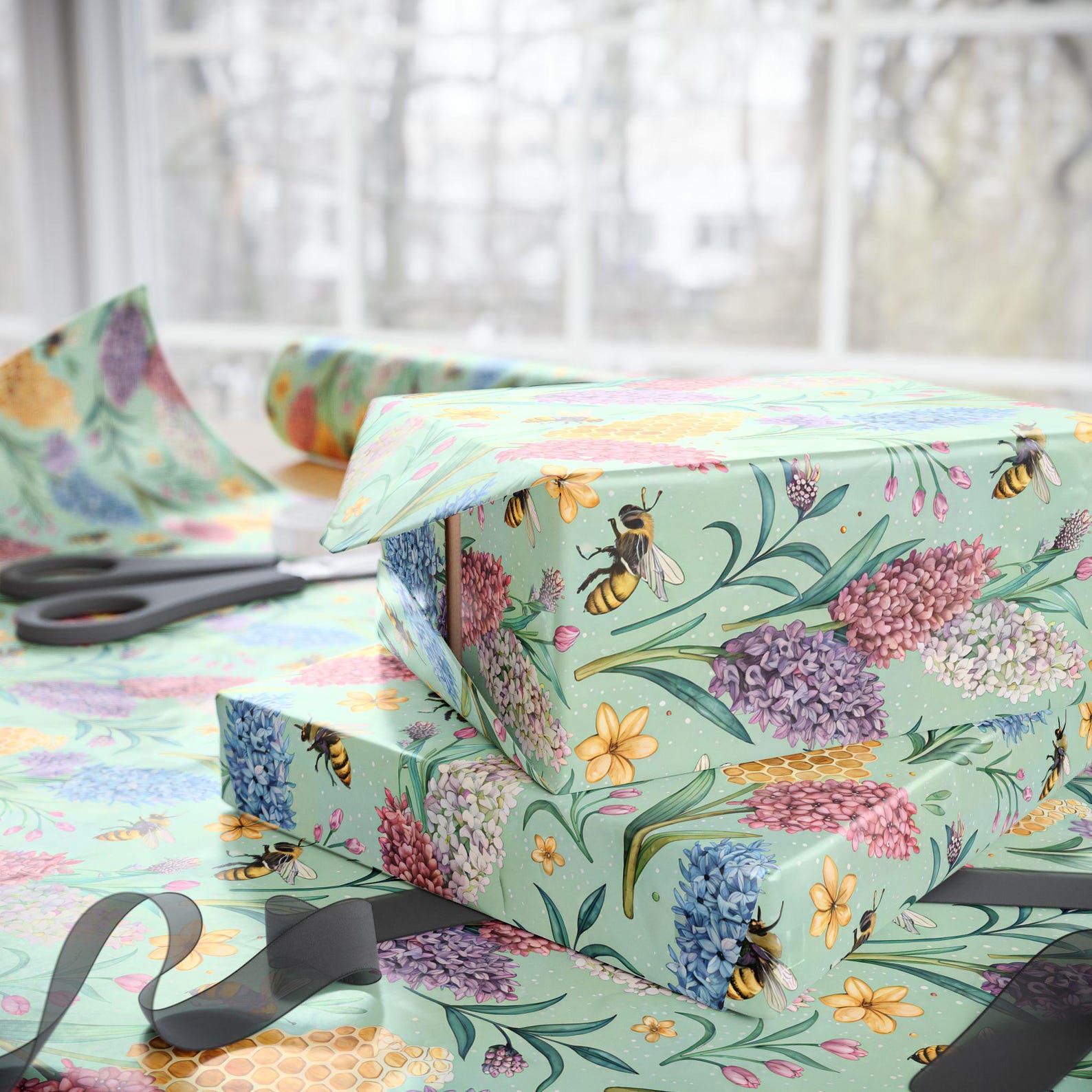 Gifts wrapped in mint green Bees and Hyacinths paper with flowers, honeycomb and bees